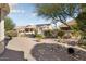 Backyard view showing a house with solar panels at 15820 W Falcon Ridge Dr, Sun City West, AZ 85375