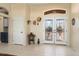 Front entry with double doors and tile flooring at 15820 W Falcon Ridge Dr, Sun City West, AZ 85375