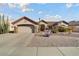 Single-story home with desert landscaping and a two-car garage at 15820 W Falcon Ridge Dr, Sun City West, AZ 85375