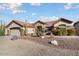 Single-story home with desert landscaping and a two-car garage at 15820 W Falcon Ridge Dr, Sun City West, AZ 85375