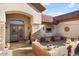 Inviting front patio with seating area and terracotta pots at 15820 W Falcon Ridge Dr, Sun City West, AZ 85375