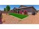 Artificial turf backyard with desert landscaping at 16019 W Avenida Del Sol --, Surprise, AZ 85387