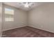 Bright bedroom with ceiling fan and neutral carpeting at 16019 W Avenida Del Sol --, Surprise, AZ 85387