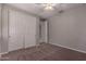 Spacious bedroom with ceiling fan and large closet at 16019 W Avenida Del Sol --, Surprise, AZ 85387