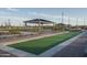 Community bocce ball court with covered seating area at 16019 W Avenida Del Sol --, Surprise, AZ 85387