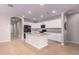 Modern kitchen with center island and white cabinets at 16019 W Avenida Del Sol --, Surprise, AZ 85387