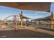 Modern playground with shade structures and climbing equipment at 16019 W Avenida Del Sol --, Surprise, AZ 85387