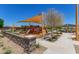 Community playground with slide and playset at 16019 W Avenida Del Sol --, Surprise, AZ 85387