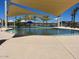 Community pool with shade structures and water features at 16019 W Avenida Del Sol --, Surprise, AZ 85387