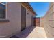 Side yard with access gate and brick pavers at 16019 W Avenida Del Sol --, Surprise, AZ 85387