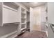 Large walk-in closet with ample shelving and hanging space at 16019 W Avenida Del Sol --, Surprise, AZ 85387