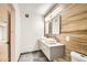 Modern bathroom with double vanity, wood-look tile, and updated fixtures at 17030 E Calaveras Ave, Fountain Hills, AZ 85268