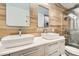 Spa-like bathroom with double vanity, modern mirrors, and stylish tile at 17030 E Calaveras Ave, Fountain Hills, AZ 85268