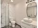 Modern bathroom with glass shower, white tile, and vanity at 17030 E Calaveras Ave, Fountain Hills, AZ 85268