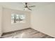 Spacious bedroom with large window and ceiling fan at 17030 E Calaveras Ave, Fountain Hills, AZ 85268