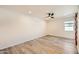 Bright bedroom with ceiling fan and wood-look floors at 17030 E Calaveras Ave, Fountain Hills, AZ 85268