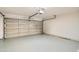 Empty garage with overhead door and projector at 17030 E Calaveras Ave, Fountain Hills, AZ 85268