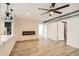 Bright living area featuring a modern electric fireplace and hardwood floors at 17030 E Calaveras Ave, Fountain Hills, AZ 85268