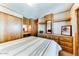 Main bedroom with built-in dresser and mirrored closet at 17200 W Bell Rd # 387, Surprise, AZ 85374