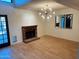 Cozy living room with brick fireplace and hardwood floors at 1722 W Brooks St, Chandler, AZ 85224