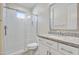 Clean bathroom featuring a glass shower, granite countertop, and white cabinets at 17527 E Silver Sage Ln, Rio Verde, AZ 85263