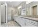 Bathroom with dual sinks, granite countertops, and a glass-enclosed shower offering a spa-like experience at 17527 E Silver Sage Ln, Rio Verde, AZ 85263