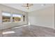 Spacious bedroom with three large windows overlooking the outdoor landscaping bringing the outside in at 17527 E Silver Sage Ln, Rio Verde, AZ 85263