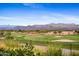 Scenic golf course with mountain views and lush landscaping, set against a clear blue sky at 17527 E Silver Sage Ln, Rio Verde, AZ 85263