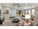 Bright open living area with neutral tones, ceiling fan, and sliding doors that access outdoor living area at 17527 E Silver Sage Ln, Rio Verde, AZ 85263