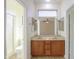 Double vanity bathroom with a large mirror and access to shower and toilet at 1861 E Birch St, Casa Grande, AZ 85122