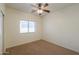 Spacious bedroom with carpet flooring and ceiling fan at 1861 E Birch St, Casa Grande, AZ 85122