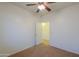 Bright bedroom with ceiling fan and door to another room at 1861 E Birch St, Casa Grande, AZ 85122