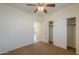 Bedroom with carpet flooring, ceiling fan, and closet at 1861 E Birch St, Casa Grande, AZ 85122