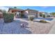 One-story house with a two-car garage and rock landscaping at 1861 E Birch St, Casa Grande, AZ 85122