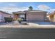 One-story home with a two-car garage and landscaped front yard at 1861 E Birch St, Casa Grande, AZ 85122