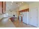 Kitchen with wood cabinets, granite counters, and tile floors at 1861 E Birch St, Casa Grande, AZ 85122