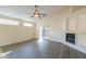 Bright living room with hardwood floors, fireplace, and sliding door to patio at 1861 E Birch St, Casa Grande, AZ 85122