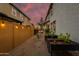 Landscaped backyard with raised garden beds and string lights at 1926 W Lariat Ln, Phoenix, AZ 85085