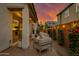 Backyard patio with modern seating and string lights under a sunset sky at 1926 W Lariat Ln, Phoenix, AZ 85085