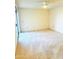 Spacious carpeted bedroom with ceiling fan at 19462 N Star Ridge Dr, Sun City West, AZ 85375