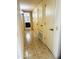 Hallway with tile floors and access to bathroom at 19462 N Star Ridge Dr, Sun City West, AZ 85375