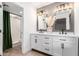 Modern bathroom with double vanity and updated fixtures at 19606 N Trail Ridge Dr, Sun City West, AZ 85375