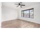 Well-lit bedroom with large window and hardwood floor at 19606 N Trail Ridge Dr, Sun City West, AZ 85375