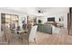 Light and airy dining area with glass table and comfortable seating at 19606 N Trail Ridge Dr, Sun City West, AZ 85375