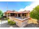 Attractive home exterior with red tile roof and desert landscaping at 19606 N Trail Ridge Dr, Sun City West, AZ 85375