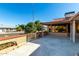 Ranch-style home with a covered patio and a well-maintained yard at 19606 N Trail Ridge Dr, Sun City West, AZ 85375