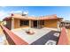 Home exterior showcasing a covered patio and landscaping at 19606 N Trail Ridge Dr, Sun City West, AZ 85375