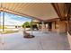 Covered patio with fountain and view of the backyard at 19606 N Trail Ridge Dr, Sun City West, AZ 85375