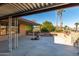 Covered patio with view of the backyard and surrounding landscape at 19606 N Trail Ridge Dr, Sun City West, AZ 85375