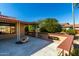 Spacious covered patio with decorative fountain and landscaped surroundings at 19606 N Trail Ridge Dr, Sun City West, AZ 85375